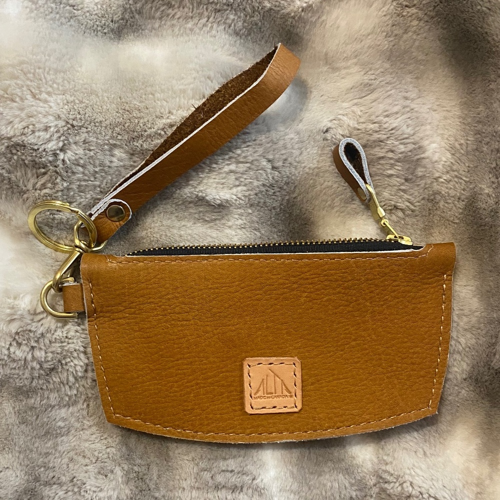 Handmade artisan made leather pouch/wristlet. Unisex